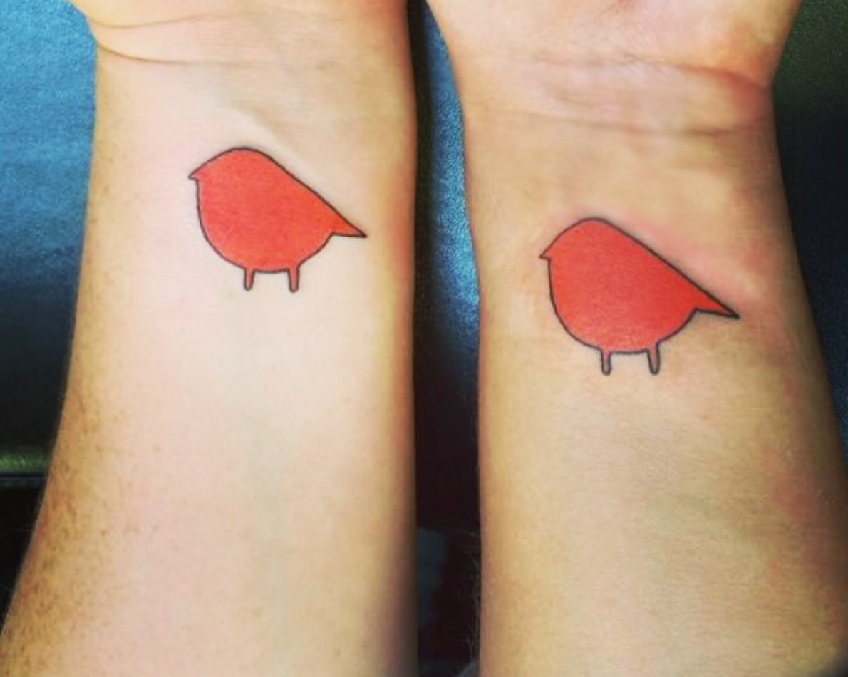 The owners were so pleased with the new logo, they had it tattooed on each of their wrists.