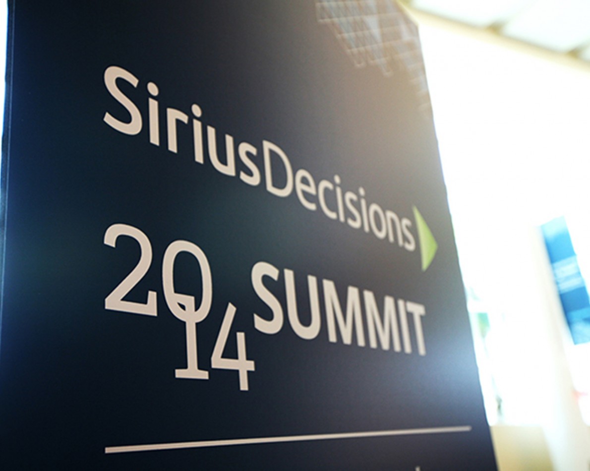 The green-arrow design of the new logo acts as effective directional signage at all SiriusDecisions events.